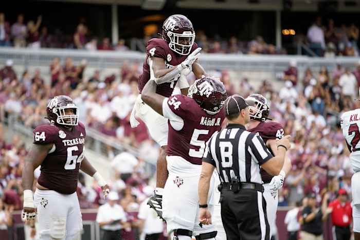 Oct 28, 2023; College Station, Texas, USA; Texas A&M Aggies running back Amari Daniels (4) and offensive lineman Mark Nabou Jr. (54) celebrate during the second quarter against the South Carolina Gamecocks at Kyle Field.